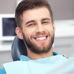 Male dental patient visiting emergency dentist in Rowlett, TX