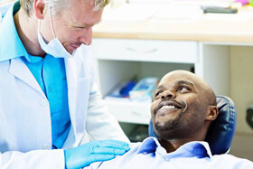 Smiling man in dental chair