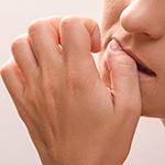Nail-biting, a habit that hurts dental implant care in Bella Vista 