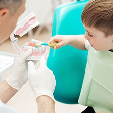 Young boy practicing toothbrushing