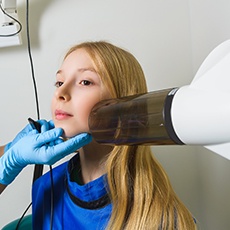Preteen girl receiving digital x-rays