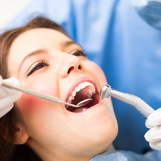 Woman receiving dental treatment